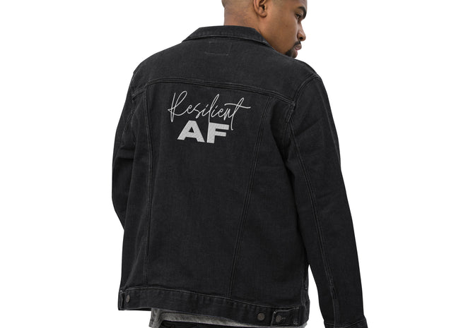 A person wearing a black denim jacket with 'Resilient AF' text printed on the back.