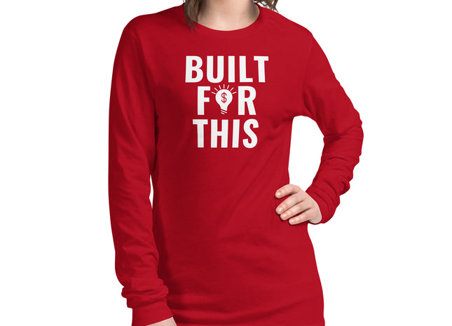 A person wearing a red long sleeve t-shirt with the text 'BUILT FOR THIS' printed on the front.
